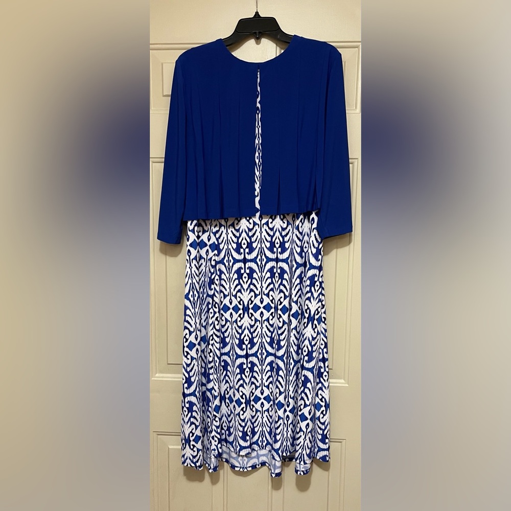 Dress with detached solid-colored shrug.